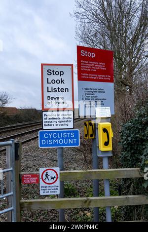 Warning notices at Level crossing number 68, Cherry Willingham,  Lincolnshire, England, UK Stock Photo