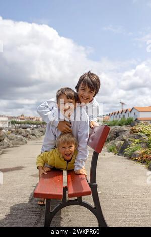 Family, visiting small town in France, Saint Jean de Luz, during summer vacation, traveling with children in Europe Stock Photo