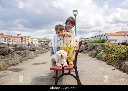 Family, visiting small town in France, Saint Jean de Luz, during summer vacation, traveling with children in Europe Stock Photo