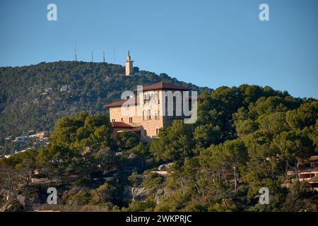 Marivent palace seen from a low angle surrounded by trees in Palma de Mallorca Spain Stock Photo