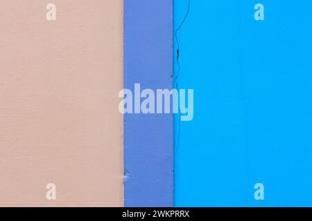 Colored wall, harmonious combination of calm colors (beige, violet, and blue) with textured background Stock Photo