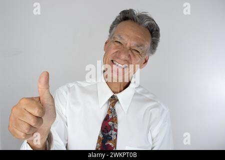 A happy elderly man giving thumbs up Stock Photo