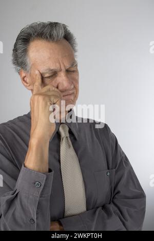 An elderly man in deep thoughts Stock Photo