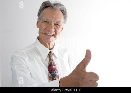 A happy elderly man giving thumbs up Stock Photo