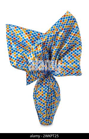 Easter chocolate egg wrapped in paper with multicolored dots isolated on white with clipping path included Stock Photo