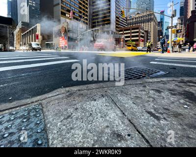 New York, USA; June 4, 2023: Smoke coming from the Big Apple's underground, wafting out into the streets through vents in the floor of Manhattan. Stock Photo
