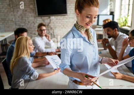 Diverse business people in office during brainstorming while discussing ideas for their new project. Stock Photo
