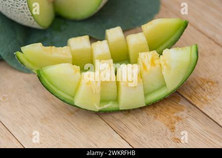 Fresh green melon on wood plate Stock Photo