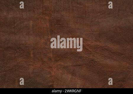 Close-Up Texture of a Brown Leather Surface Showcasing Fine Details Stock Photo