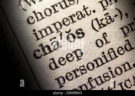 Definition of word chaos on dictionary page, close-up Stock Photo