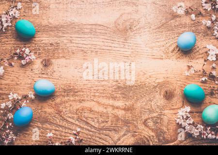 Easter background with colorful eggs in nest on  wooden background Stock Photo