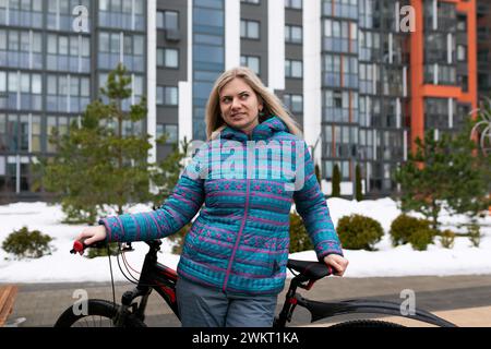 Nice young woman rented a bicycle Stock Photo
