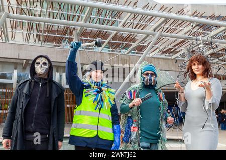 Edinburgh, Scotland. 22 February 2024.  Models outside the Scottish Parliament after taking to the catwalk for Organised by Friends of the Earth Scotland , to raise awareness of our wasteful and polluting levels of material consumption. © Richard Newton / Alamy Live News Stock Photo