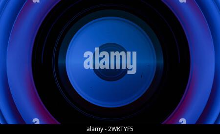 A close-up of a camera lens with multi-colored light painting effects, creating a vibrant and artistic interpretation of the lens's function and beaut Stock Photo