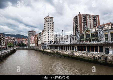 BILBAO, SPAIN - JUNE 14, 2023: Wide-angle view of the bank of the Nervion river in Bilbao, Spain. Stock Photo