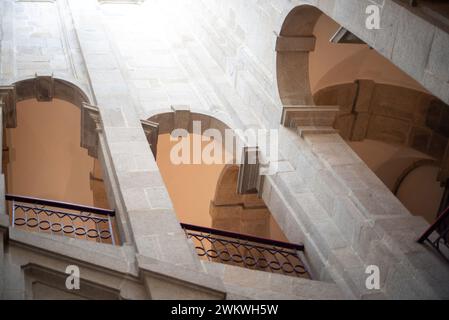 Interior of an ancient building with stairs, columns and arches. Portuguese Center of Photography Stock Photo