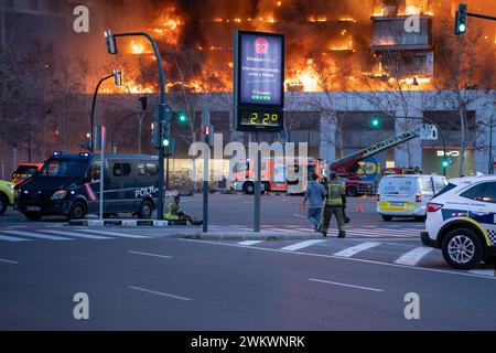 Valencia, Spain - February 22, 2024: Exhausted firefighters after intervening in a large fire in a 14-story residential building in the city of Valenc Stock Photo