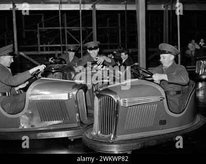 Marines riding electric automobiles, Mission Beach amusement center, San Diego, California, USA, Russell Lee, U.S. Farm Security Administration, May 1941 Stock Photo