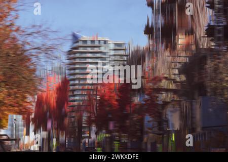 Intentional Camera Movement (ICM) and Multiple Exposure create  unique impression of Johnson Street, replete with trees in red, fall foliage Stock Photo