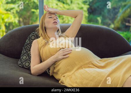 pregnant woman experiences a fainting spell, highlighting the challenges and vulnerabilities that can arise during pregnancy. Seeking immediate care Stock Photo