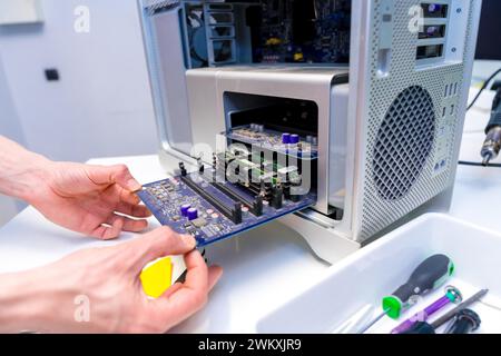 Close-up of an unrecognizable engineer technician working with electronic equipment in the lab Stock Photo