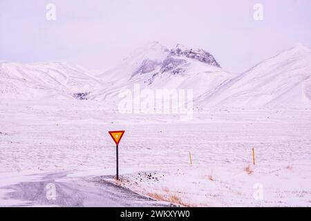 Road sign on a snow-covered road outside Thingvellir National Park in Iceland Stock Photo
