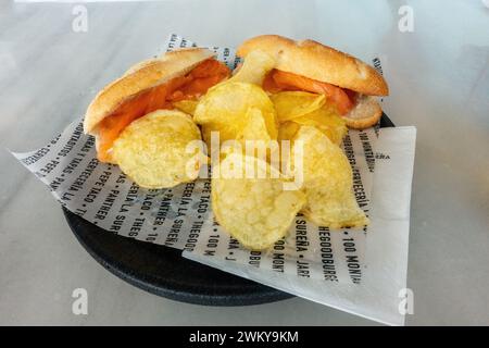 Smoked Salmon Mini Finger Roll Subs Bocadillos Bread Sandwiches  Served With Potato Crisps Chips From The Spanish Tapas Fast Food Store100 Montaditos Stock Photo