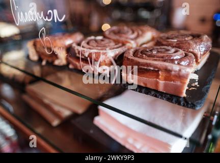 Some Delicious Cinnamon Buns (Rolls) In A Trendy Cafe Or Bakery Stock Photo