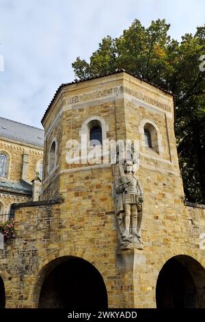 Architectural detail w/ figure of St. Michael, WWI memorial, exterior of St Nikolaus Kirche (St Nicholas Church) Ankum, Germany. Stock Photo