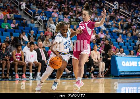 UCLA Bruins guard Charisma Osborne (20) drives against Utah Utes guard Kennady McQueen (24) during a NCAA women’s basketball game, Thursday, February Stock Photo