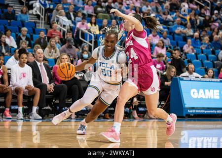 UCLA Bruins guard Charisma Osborne (20) drives against Utah Utes guard Kennady McQueen (24) during a NCAA women’s basketball game, Thursday, February Stock Photo