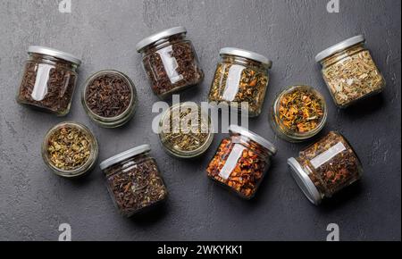 Tea time assortment: Various dry tea leaves. Flat lay Stock Photo
