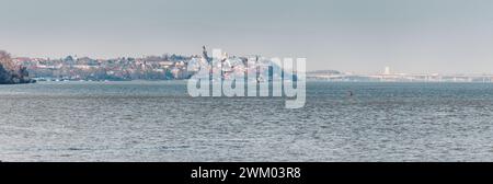 Danube river gracefully meanders past the historic Zemun district of Belgrade with Gardos tower, where charming red-roofed houses and ancient churches Stock Photo