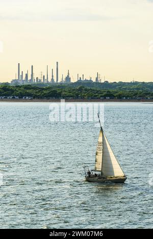 Sunset over Gas tankers and refinery Esso Oil Terminal, Southampton, Hampshire, England Stock Photo