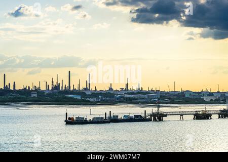 Sunset over Gas tankers and refinery Esso Oil Terminal, Southampton, Hampshire, England Stock Photo