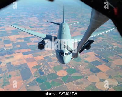 A KC-46 Pegasus is refueled by a KC-135 Stratotanker from Altus Air Force Base, Oklahoma, in Oklahoma airspace, Oct. 20, 2022.Courtesy Photo Stock Photo