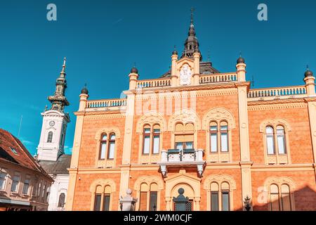 04 January 2024, Novi Sad, Serbia: regal elegance of Novi Sad's Bishop Palace as people strolling by, embodying the rich cultural heritage of Vojvodin Stock Photo