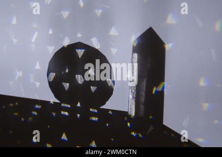 An object viewed through a laser beam refracted by a prism Stock Photo