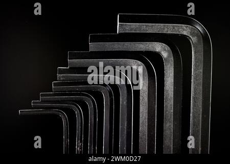 Close up of a metal allen keys group on a black background Stock Photo