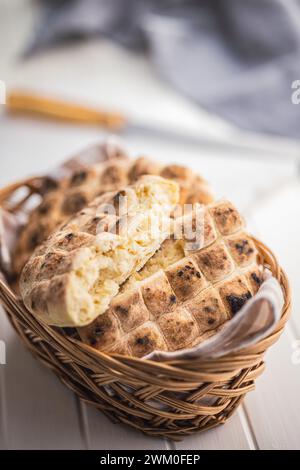 Arabic flat pita bread in basket on the white table. Stock Photo