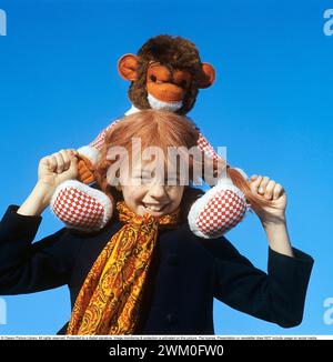 Inger Nilsson. Born in 1959. Swedish child actress known for playing the role of  Pippi Longstocking in the TV series and movies based on the character of author Astrid Lindgren. Here dressed in Pippi clothes and the red hair in  braids. A stuffed animal represents the monkey Herr Nilsson who appeared in the films. 17 February. 1970 *** Local Caption *** Stock Photo