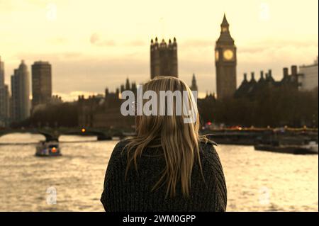 Somebody looking towards the Palace of Westminster at the end of a clear November day Stock Photo