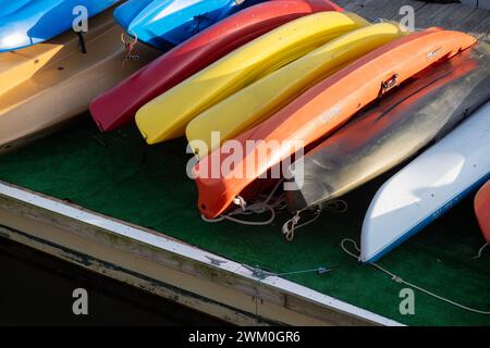 Colorful Kayaks stored on a dock Stock Photo