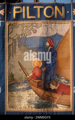 Pilton church banner Somerset England. Shows the Christ Child visiting Glastonbury with Joseph of Arimathea a west country legend. Seen in a boat on the Somerset Levels with Glastonbury Tor and the ruin of St Michael Church depicted in the banner. 1989 1980s UK HOMER SYKES Stock Photo
