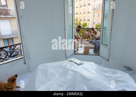 Couple having lunch in balcony at home Stock Photo