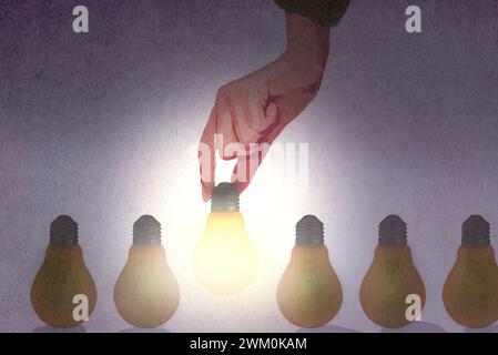 Hand choosing light bulb from row of unlit bulbs Stock Photo