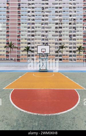 Basketball court in front of building Stock Photo