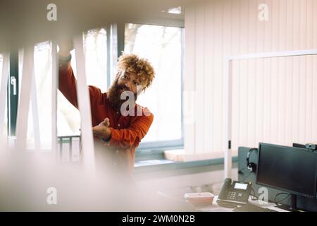 Mature businessman giving presentation in office Stock Photo