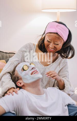 Couple doing skincare and having fun at home Stock Photo
