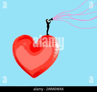 Woman speaking through megaphone from top of oversized heart shaped balloon Stock Photo
